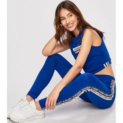 Adidas Originals - Legginsy. Niebieskie spodnie damskie adidas Originals, s, bez wzorów, z elastanu. W wyprzedaży za 119,90 zł.