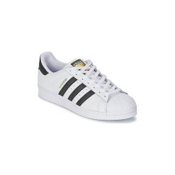 Buty adidas SUPERSTAR. Białe trampki i tenisówki damskie Adidas, bez wzorów, bez zapięcia. Za 381,70 zł.