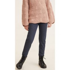 Mango Kids - Spodnie dziecięce Biarritz 110-164 cm. Niebieskie spodnie dziewczęce Mango Kids, bez wzorów, z elastanu, casualowe. W wyprzedaży za 29,90 zł.