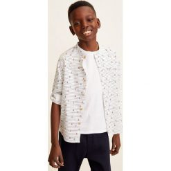 Mango Kids - Koszula dziecięca Damao4 110-164 cm. Białe koszule chłopięce marki Mango Kids, bez wzorów, z bawełny, casualowe, bez kołnierzyka, z długim rękawem, długie. Za 69,90 zł.