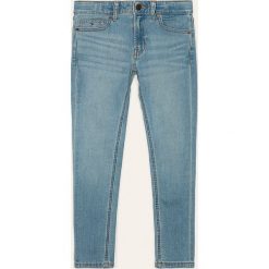 Tommy Hilfiger - Jeansy dziecięce SIMON SKINNY OCLBST 128-176. Niebieskie spodnie chłopięce TOMMY HILFIGER, z aplikacjami, z elastanu. Za 229,90 zł.