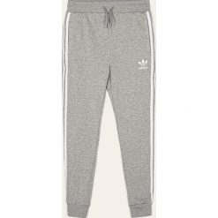 Adidas Originals - Spodnie dziecięce 128-164 cm. Szare spodnie dziewczęce adidas Originals, z aplikacjami, z bawełny. Za 149,90 zł.