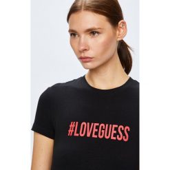 Guess Jeans - Top. Czarne bluzki z odkrytymi ramionami marki Guess Jeans, s, z nadrukiem, z elastanu, z okrągłym kołnierzem. W wyprzedaży za 119,90 zł.