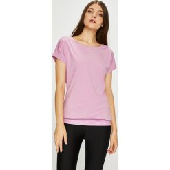 Puma - Top. Różowe topy damskie marki Puma, s, z elastanu, z okrągłym kołnierzem. W wyprzedaży za 89,90 zł.