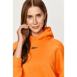 Reebok - Bluza. Pomarańczowe bluzy damskie Reebok, s, bez wzorów, z bawełny, z długim rękawem, długie, z kapturem. Za 229,90 zł.
