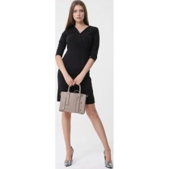 Czarna Sukienka Bluebellie. Czarne sukienki damskie Born2be, do pracy, xl, bez wzorów, z dzianiny, eleganckie, bez kołnierzyka, bez rękawów, mini, dopasowane. Za 89,99 zł.