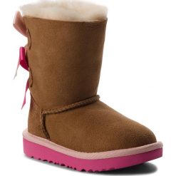 Buty UGG - T Bailey Bow II 1017394T T/Cpal. Pomarańczowe śniegowce dziewczęce Ugg, bez zapięcia. W wyprzedaży za 449,00 zł.