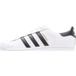 Adidas Originals SUPERSTAR Tenisówki i Trampki white/core black. Białe trampki dziewczęce adidas Originals, ze skóry. W wyprzedaży za 223,20 zł.