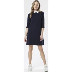 Granatowa Sukienka Avadah. Niebieskie sukienki damskie Born2be, s, bez wzorów, z dzianiny, eleganckie, bez kołnierzyka, bez rękawów, mini, trapezowe. Za 69,99 zł.