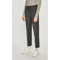 Calvin Klein - Spodnie. Szare spodnie damskie Calvin Klein, bez wzorów, z elastanu, casualowe. W wyprzedaży za 319,90 zł.