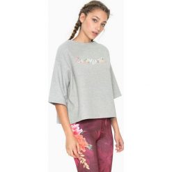 Dwustronna koszulka w kolorze szarym ze wzorem. Szare bluzki sportowe damskie marki Desigual Sport, s. W wyprzedaży za 130,95 zł.
