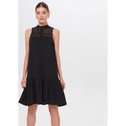 Sukienka midi Eco Aware - Czarny. Czarne sukienki damskie Mohito, s, bez wzorów, bez kołnierzyka, bez rękawów, midi. Za 99,99 zł.