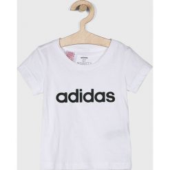 Adidas Performance - Top dziecięcy 110-170 cm. Białe bluzki dziewczęce adidas Performance, z nadrukiem, z bawełny, z okrągłym kołnierzem, z krótkim rękawem, krótkie, bez kaptura. W wyprzedaży za 49,90 zł.