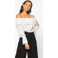 Bluzka w kolorze biało-czarnym. Czarne bluzki damskie Bambina Mia, l, w paski, bez kołnierzyka, bez rękawów. W wyprzedaży za 124,95 zł.