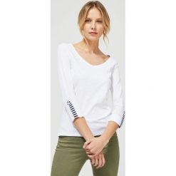 Bluzka bawełniana. Białe bluzki damskie Moodo, xxl, bez wzorów, z bawełny, bez kołnierzyka, bez rękawów. Za 39,99 zł.