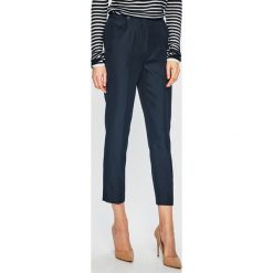 Tommy Hilfiger - Spodnie. Niebieskie spodnie damskie TOMMY HILFIGER, s, z haftami, z poliesteru, casualowe. W wyprzedaży za 299,90 zł.