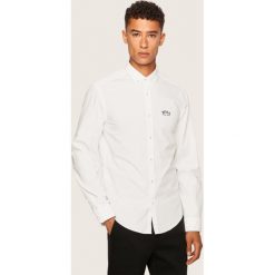 Koszula Boss Biadia_R 50431538. Niebieskie koszule męskie Boss, s, bez wzorów, casualowe, bez kołnierzyka, bez rękawów. Za 429,00 zł.