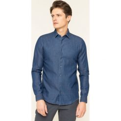 Koszula Calvin Klein Denim Washed K10K104135. Niebieskie koszule męskie Calvin Klein, m, bez wzorów, z bawełny, casualowe, bez kołnierzyka, bez rękawów. W wyprzedaży za 259,00 zł.