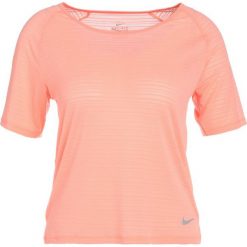 Nike Performance MILER Tshirt basic crimson pulse/heather. Brązowe topy sportowe damskie Nike Performance, l, z elastanu. Za 149,00 zł.