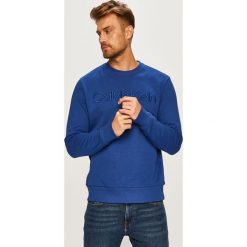 Calvin Klein Bluza. Bluzy męskie Calvin Klein, bez wzorów, z tkaniny, bez kołnierzyka, bez rękawów, bez kaptura. Za 299,00 zł.