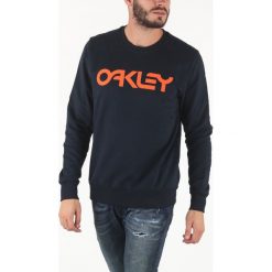 Oakley B1B Bluza Niebieski. Niebieskie bluzy męskie Oakley, xxl, z nadrukiem, z bawełny, bez kołnierzyka, bez rękawów, bez kaptura. Za 283,95 zł.
