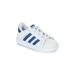 Buty Dziecko adidas SUPERSTAR EL. Białe trampki dziewczęce Adidas, bez wzorów, bez zapięcia. Za 203,20 zł.