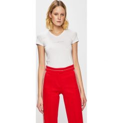 Emporio Armani - Top. Białe bluzki damskie Emporio Armani, s, bez wzorów, z elastanu, bez kołnierzyka, z krótkim rękawem. Za 189,90 zł.