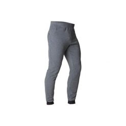 Spodnie dresowe slim Gym & Pilates 560 męskie. Szare spodnie męskie marki DOMYOS, s, bez wzorów, z elastanu. W wyprzedaży za 69,99 zł.