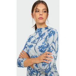 Sukienka w kwiaty. Sukienki damskie Greenpoint, w kwiaty, z elastanu, bez kołnierzyka, bez rękawów. Za 119,99 zł.