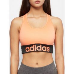 Stanik sportowy adidas pomarańczowe. Pomarańczowe biustonosze sportowe damskie Adidas, s, bez wzorów, z poliesteru. Za 89,90 zł.