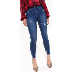 SPODNIE DAMSKIE SLIM. Niebieskie spodnie damskie Top Secret, z jeansu. Za 129,99 zł.