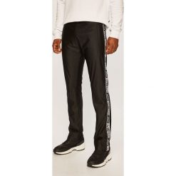 Roberto Cavalli Sport - Spodnie. Czarne spodnie męskie Roberto Cavalli Sport, na co dzień, s, bez wzorów, z poliesteru, sportowe. Za 619,90 zł.