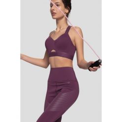 Legginsy treningowe z wysokim stanem 4FPro SPDF410 - fiolet. Różowe legginsy damskie 4f, bez wzorów, z dzianiny. Za 199,99 zł.
