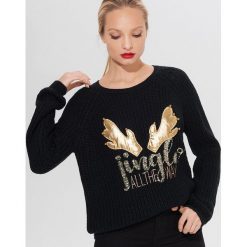 Świąteczny sweter z aplikacją - Czarny. Czarne swetry damskie Mohito, s, z aplikacjami, wizytowe, bez rękawów, bez kaptura. W wyprzedaży za 39,99 zł.