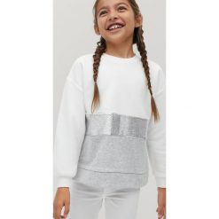 Mango Kids - Bluza dziecięca Plata7 110-164 cm. Białe bluzy dziewczęce Mango Kids, bez wzorów, z elastanu, bez rękawów, bez kaptura. Za 89,99 zł.
