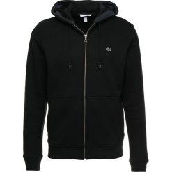 Lacoste Bluza z kapturem noir meridien. Czarne bluzy męskie marki Lacoste, xs, z bawełny, z kapturem. Za 509,00 zł.