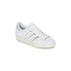 Buty adidas SUPERSTAR 80s W. Białe trampki i tenisówki damskie Adidas, bez wzorów, bez zapięcia. Za 479,00 zł.