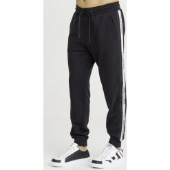 SPODNIE DRESOWE emporio armani. Czarne spodnie męskie m, z dresówki. Za 849,00 zł.