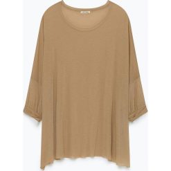 Tunika "Ohio" w kolorze beżowym. Brązowe tuniki damskie American Vintage, bez wzorów, z wełny, z okrągłym kołnierzem, bez rękawów. W wyprzedaży za 117,95 zł.