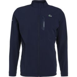Lacoste Sport Kurtka Outdoor marine. Niebieskie kurtki trekkingowe męskie Lacoste Sport, m, z elastanu. W wyprzedaży za 546,75 zł.