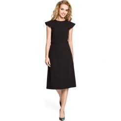 ROCHELLE Sukienka rozkloszowana z falbankami przy rękawach - czarna. Czarne sukienki balowe marki Moe, na imprezę, s, z falbankami, mini, dopasowane. Za 136,99 zł.