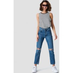 Rut&Circle Jeansy z rozdarciami Louisa - Blue. Niebieskie spodnie damskie z wysokim stanem marki Rut&Circle, z podwyższonym stanem. Za 202,95 zł.
