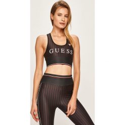 Guess Jeans - Biustonosz sportowy. Czarne biustonosze sportowe damskie Guess Jeans, xs, z aplikacjami, z elastanu. W wyprzedaży za 139,90 zł.