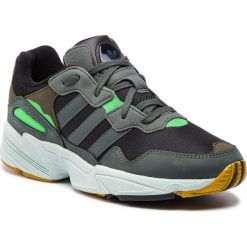 Buty adidas - Yung-96 F35018 Cblack/Legivy/Rawoch. Szare półbuty męskie Adidas, na co dzień, bez wzorów, ze skóry ekologicznej, bez zapięcia. W wyprzedaży za 229,00 zł.