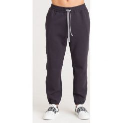 SPODNIE DRESOWE Emporio Armani. Niebieskie spodnie męskie xxl, z aplikacjami, z dresówki. Za 565,00 zł.