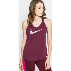 Nike - Top. Szare topy sportowe damskie Nike, s, z nadrukiem, z elastanu, z okrągłym kołnierzem. W wyprzedaży za 119,90 zł.