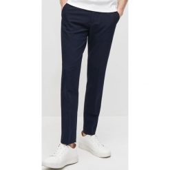 Eleganckie spodnie super slim fit -. Spodnie męskie Reserved, bez wzorów, eleganckie. Za 129,99 zł.