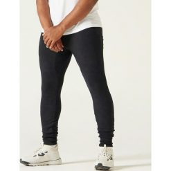 Spodnie skinny dresowe Gym & Pilates 500. Czarne spodnie męskie NYAMBA, xl, bez wzorów, z elastanu. Za 69,99 zł.