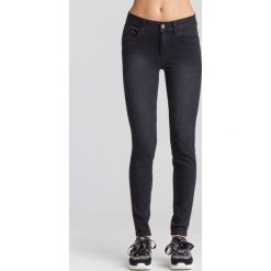 JEANSY Divine SLIM FIT LIU JO. Czarne jeansy damskie Liu Jo, z aplikacjami, z jeansu, z podwyższonym stanem. Za 749,00 zł.