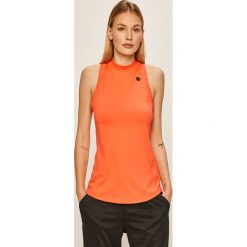 Under Armour - Top. Czerwone topy damskie Under Armour, s, bez wzorów, z elastanu, z okrągłym kołnierzem. Za 189,90 zł.